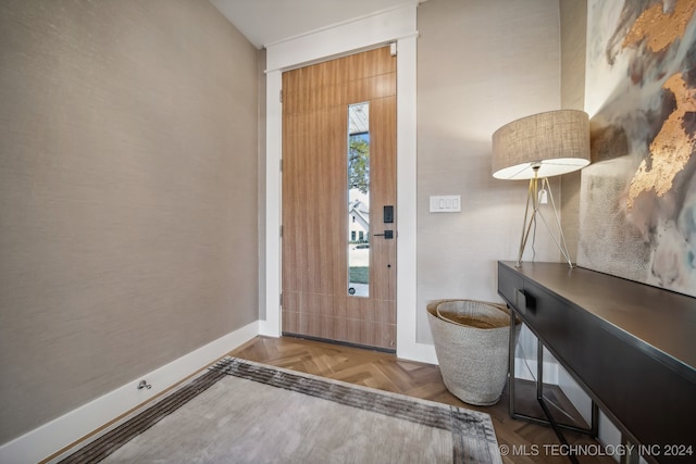 entrance foyer featuring plenty of natural light and parquet floors