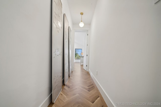 corridor with light parquet floors