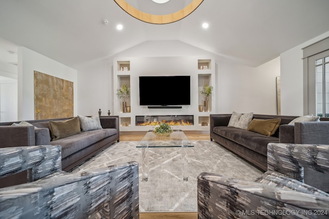 living room featuring hardwood / wood-style floors and lofted ceiling