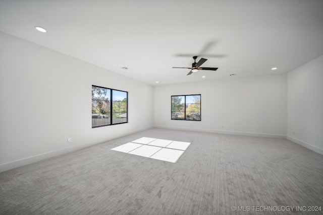 carpeted empty room with ceiling fan