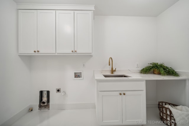 laundry room with cabinets, washer hookup, electric dryer hookup, and sink