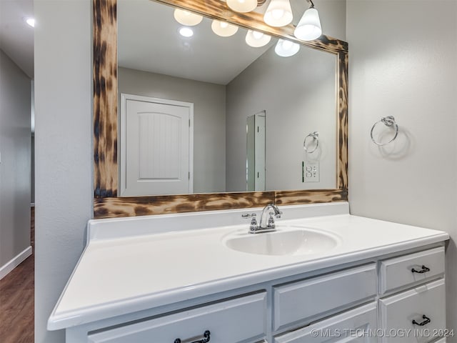 bathroom featuring hardwood / wood-style floors and vanity