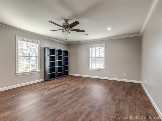 unfurnished room with a wealth of natural light, ceiling fan, dark hardwood / wood-style floors, and ornamental molding