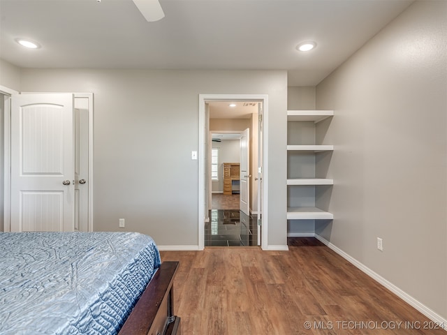 bedroom featuring ceiling fan and hardwood / wood-style flooring