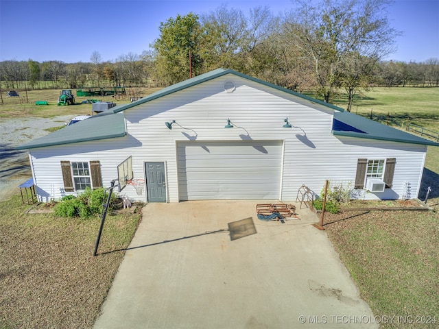 exterior space featuring a garage and a yard