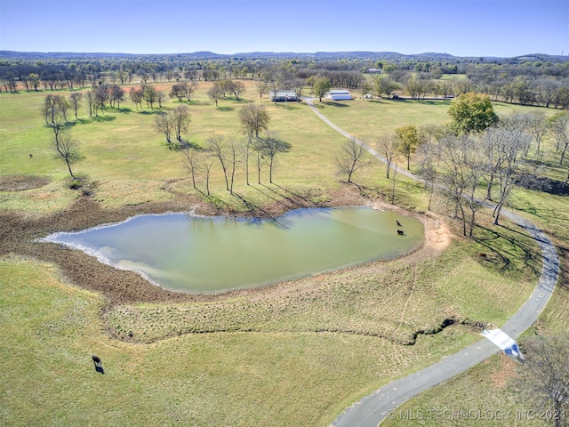 birds eye view of property featuring a water view and a rural view