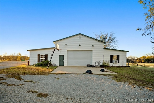 view of front of property with a front lawn and cooling unit