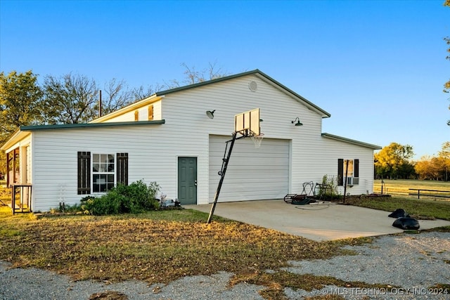 back of property featuring a garage