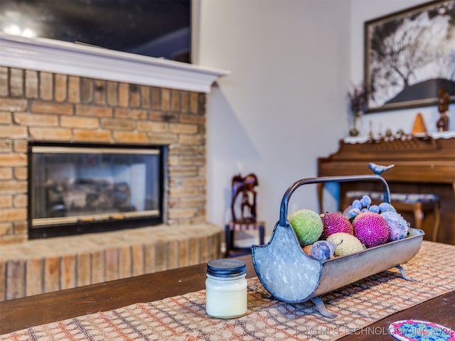 bedroom with wood-type flooring and a fireplace