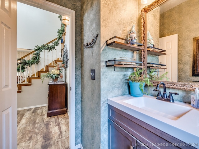 bathroom with wood-type flooring and vanity