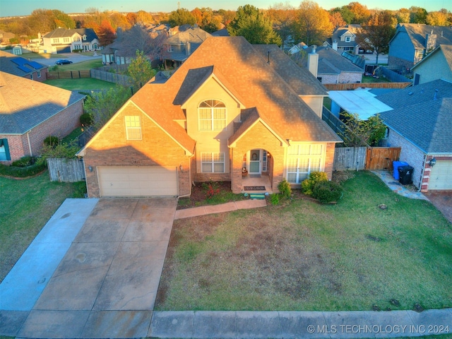 view of front of house with a front lawn and a garage