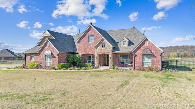 view of front of home with a front lawn