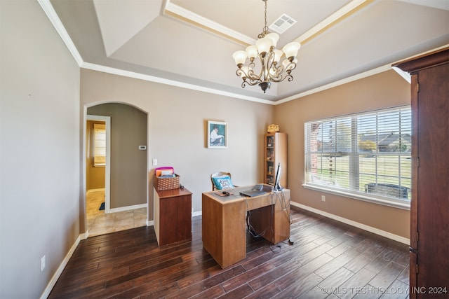 office area featuring a raised ceiling, crown molding, dark wood-type flooring, and a notable chandelier