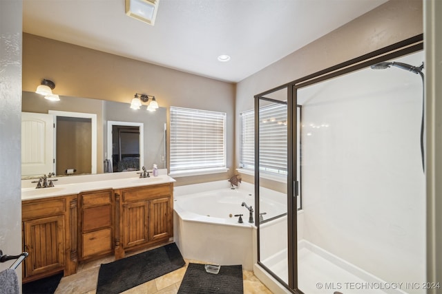 bathroom with tile patterned floors, separate shower and tub, and vanity