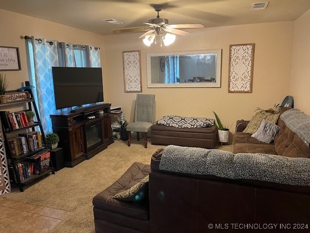 living room featuring carpet flooring and ceiling fan