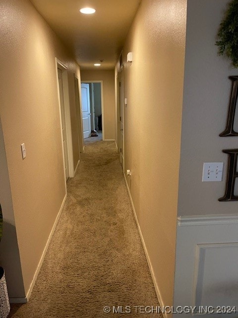 hall featuring carpet