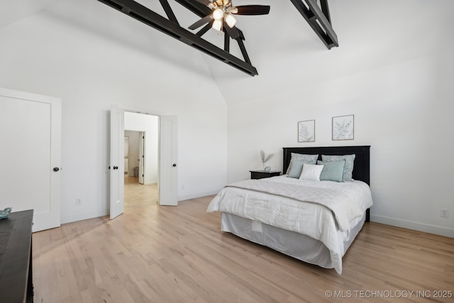 bedroom featuring ceiling fan, high vaulted ceiling, and light hardwood / wood-style flooring