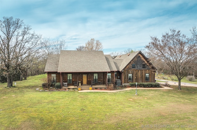 view of front of house featuring a front lawn and covered porch