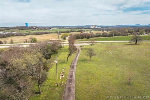 birds eye view of property with a mountain view and a rural view