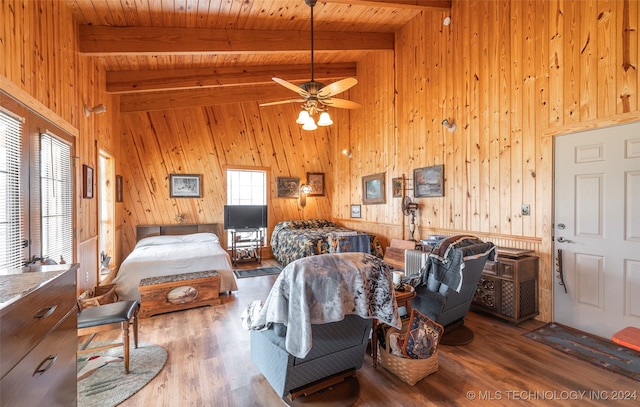 bedroom featuring wood ceiling, wooden walls, beam ceiling, high vaulted ceiling, and hardwood / wood-style floors