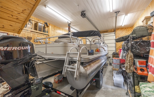 garage featuring wooden walls