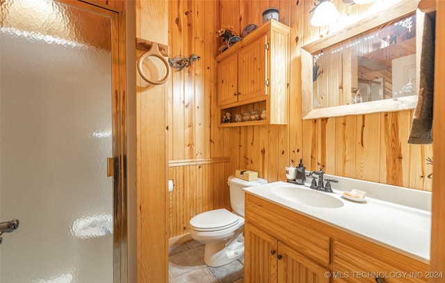 bathroom with wooden walls, tile patterned flooring, and an enclosed shower