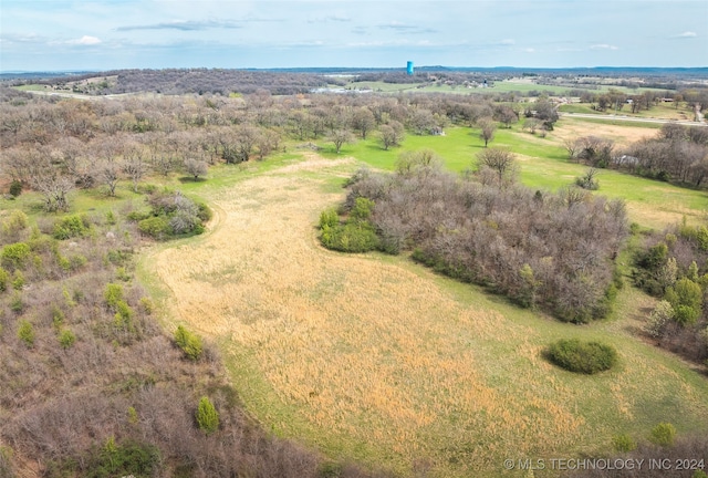 birds eye view of property with a rural view