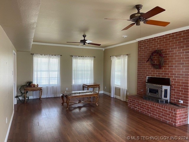 interior space with a textured ceiling, dark hardwood / wood-style floors, ceiling fan, and crown molding