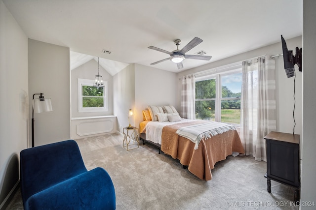 carpeted bedroom with vaulted ceiling and ceiling fan