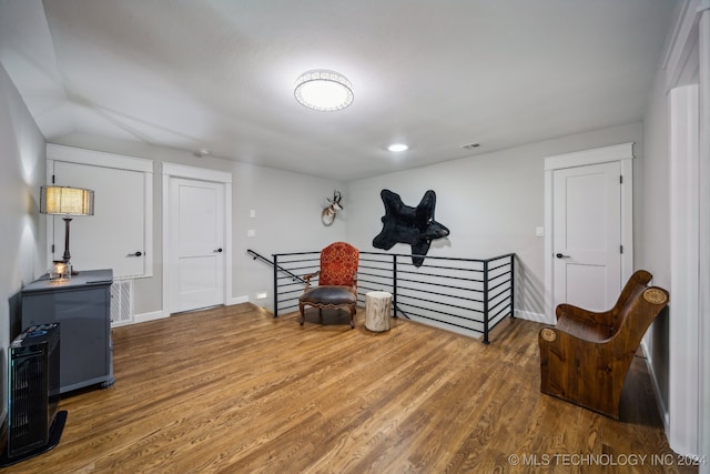 sitting room featuring dark hardwood / wood-style floors