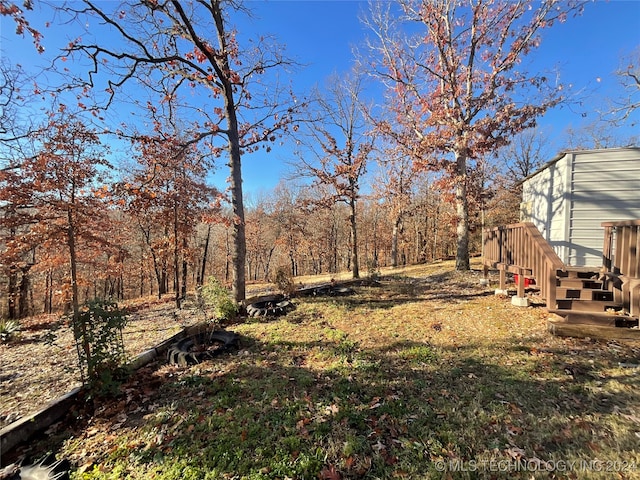 view of yard featuring a wooden deck