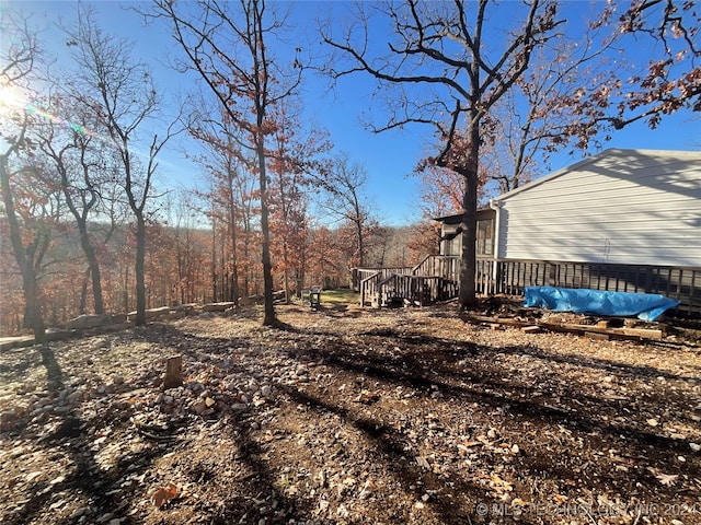 view of yard with a wooden deck