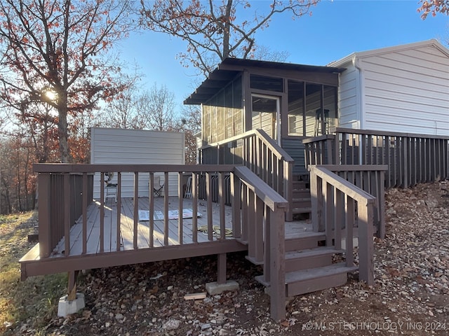 wooden deck featuring a sunroom