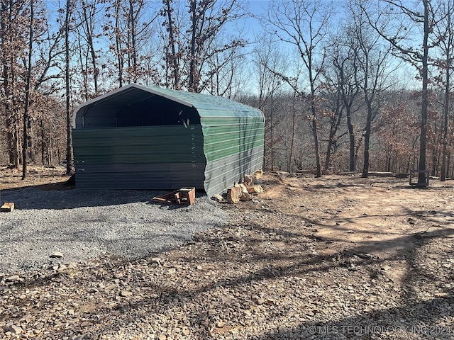 view of outbuilding featuring a carport