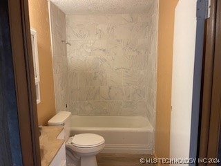 full bathroom with bathtub / shower combination, a textured ceiling, vanity, hardwood / wood-style floors, and toilet