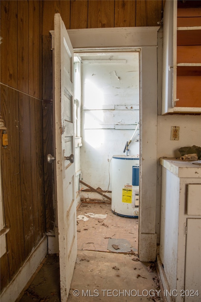 utility room with electric water heater