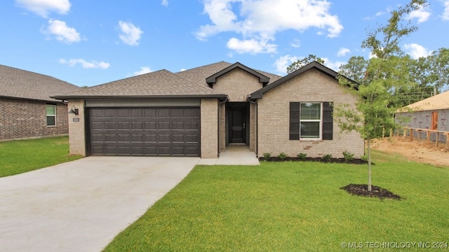 single story home with a front yard and a garage