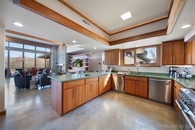 kitchen featuring kitchen peninsula, sink, plenty of natural light, and appliances with stainless steel finishes