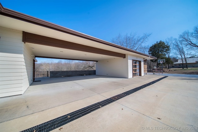 garage featuring a carport