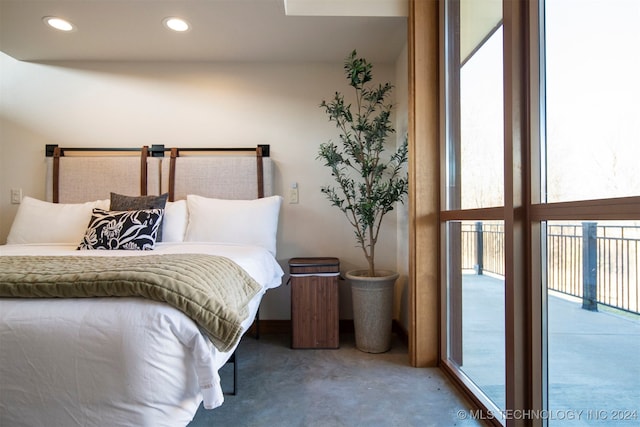 bedroom with carpet, access to outside, and multiple windows