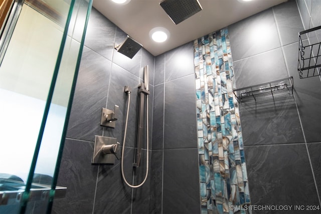 bathroom with a tile shower