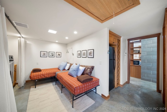 living room featuring concrete flooring