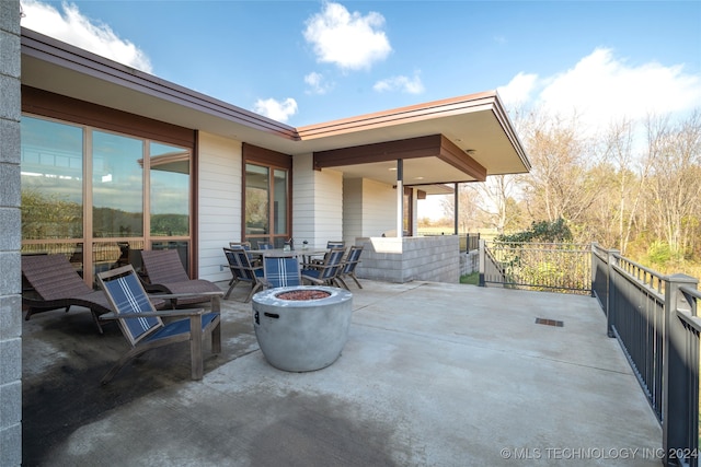 view of patio with an outdoor fire pit