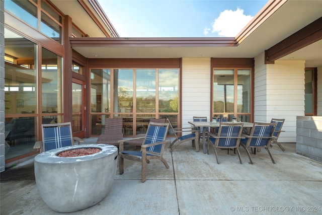 view of patio / terrace featuring an outdoor fire pit