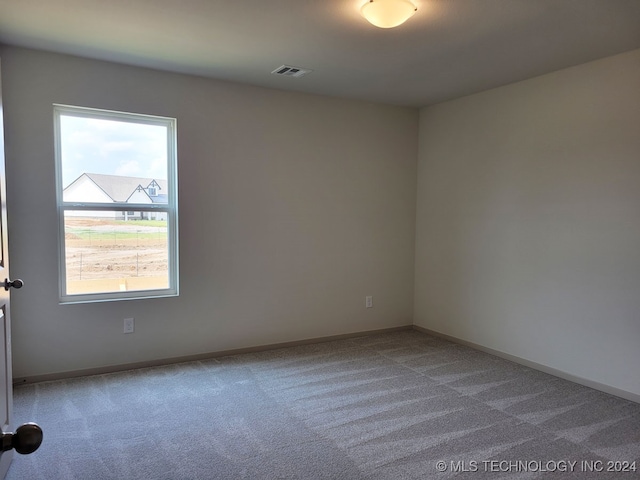 empty room featuring carpet floors