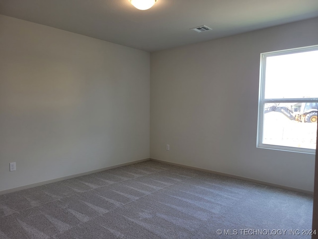 spare room with carpet