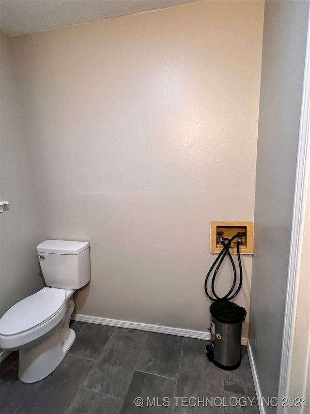 bathroom featuring tile patterned flooring and toilet