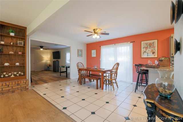 dining area featuring light hardwood / wood-style floors and ceiling fan