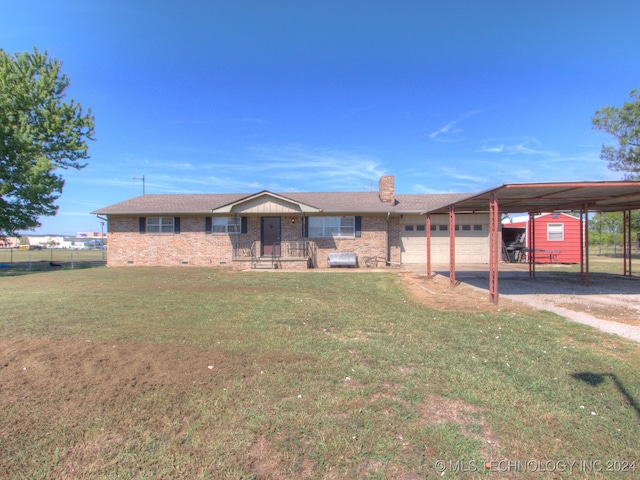 view of front of home featuring a garage, a front yard, and a carport