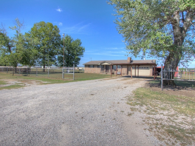 view of front facade with a front yard and a garage